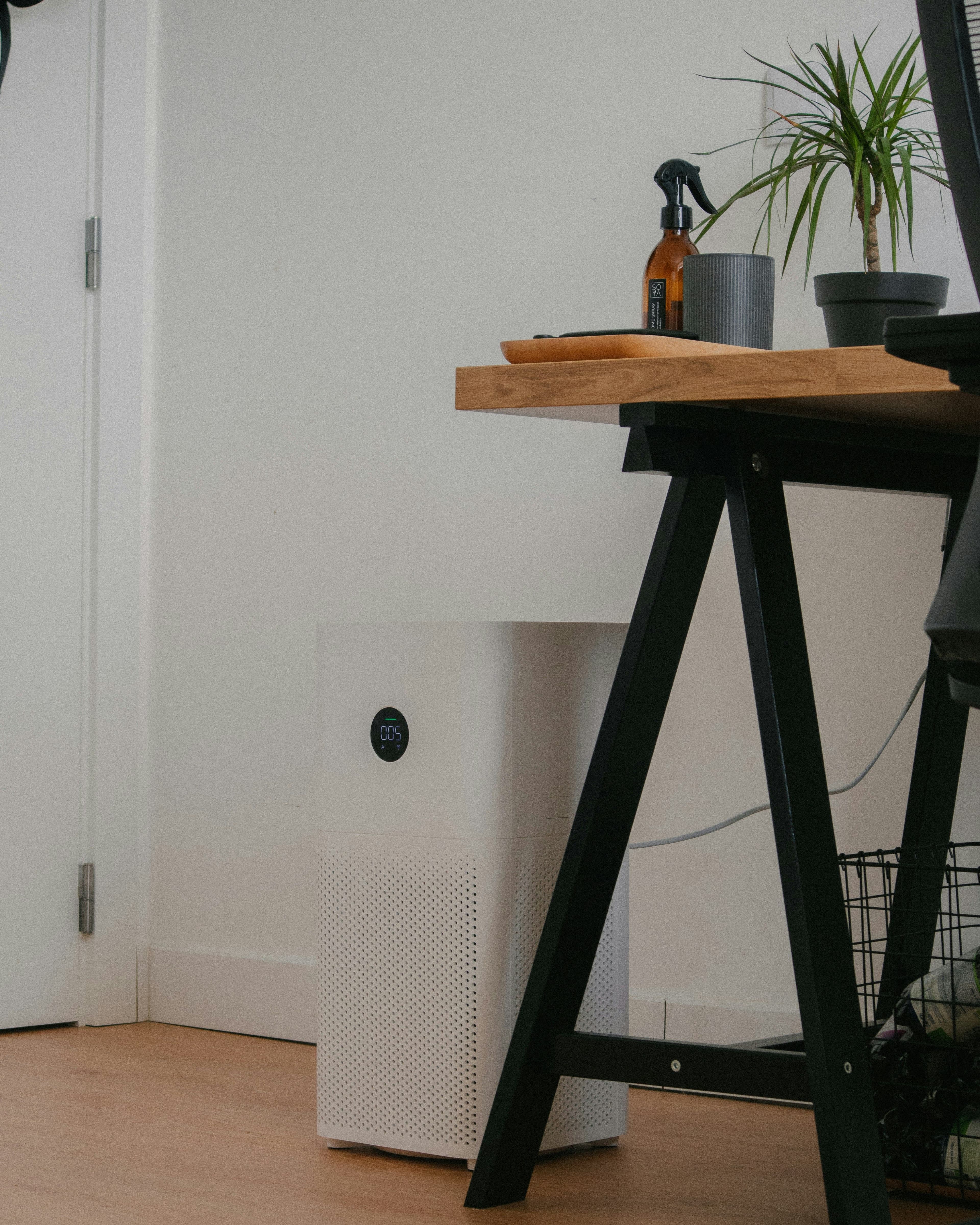 An air purifier found in a room under a desk.